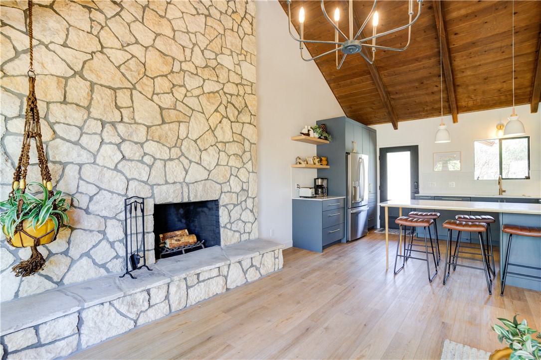 1032 Grass Valley Road Lake Arrowhead, CA 92352 - Photo 12 of 48 a living room with furniture and a fireplace with wooden floor