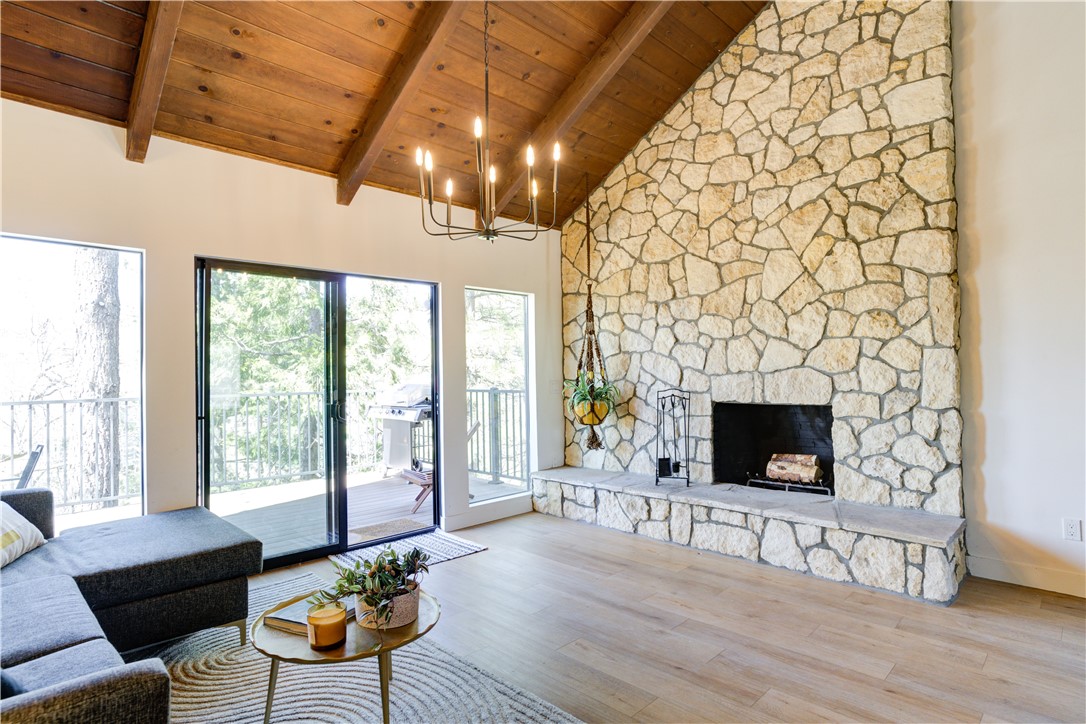 1032 Grass Valley Road Lake Arrowhead, CA 92352 - Photo 14 of 48 a living room with fireplace furniture and a floor to ceiling window