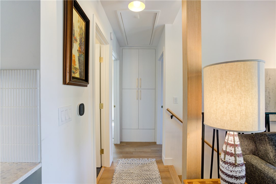 1032 Grass Valley Road Lake Arrowhead, CA 92352 - Photo 15 of 48 a view of a hallway with paintings on the wall