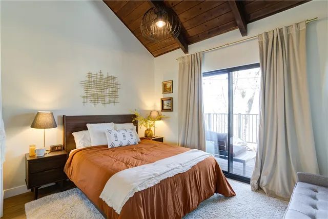 a bedroom with bed and window