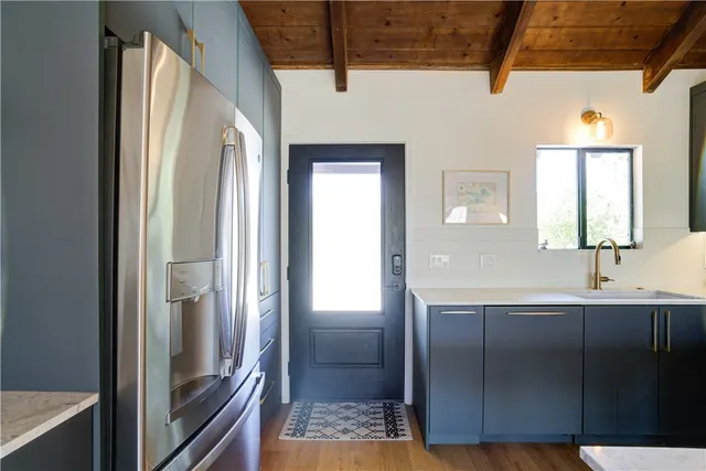 a bathroom with a sink a mirror and shower