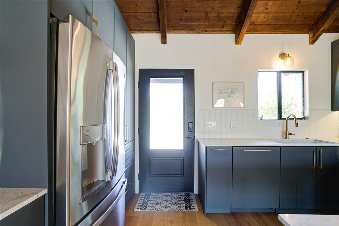 1032 Grass Valley Road Lake Arrowhead, CA 92352 - Photo 2 of 48 a bathroom with a sink a mirror and shower