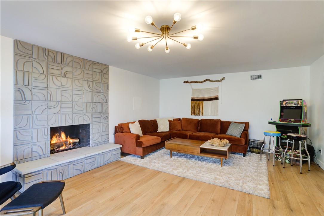 1032 Grass Valley Road Lake Arrowhead, CA 92352 - Photo 25 of 48 a living room with furniture and a fireplace