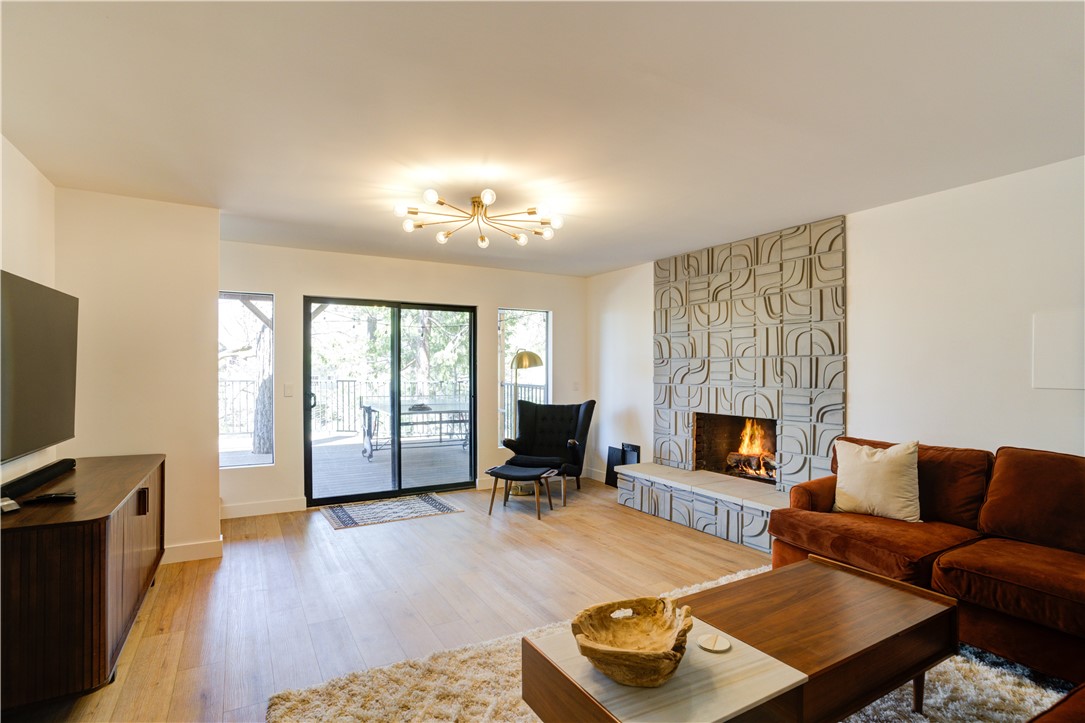 1032 Grass Valley Road Lake Arrowhead, CA 92352 - Photo 26 of 48 a living room with furniture and a fireplace