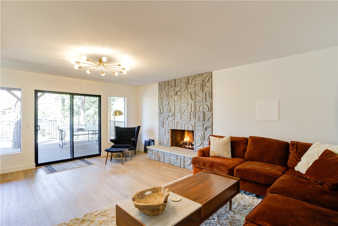 1032 Grass Valley Road Lake Arrowhead, CA 92352 - Photo 27 of 48 a living room with furniture and a fireplace