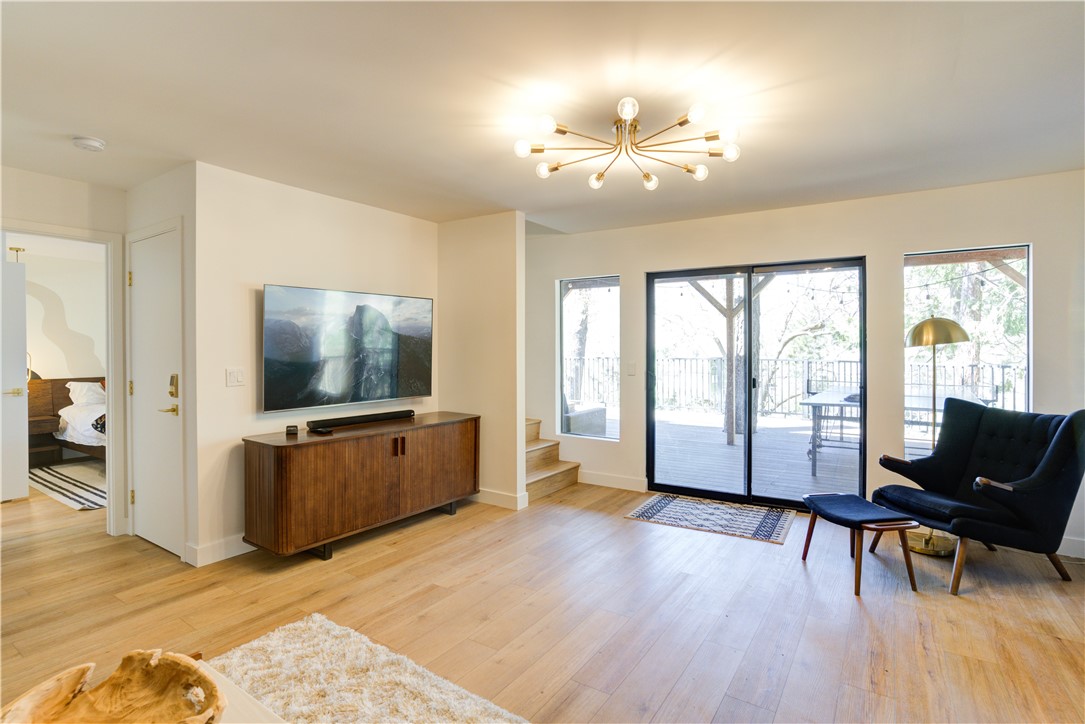 1032 Grass Valley Road Lake Arrowhead, CA 92352 - Photo 28 of 48 a living room with furniture and a flat screen tv