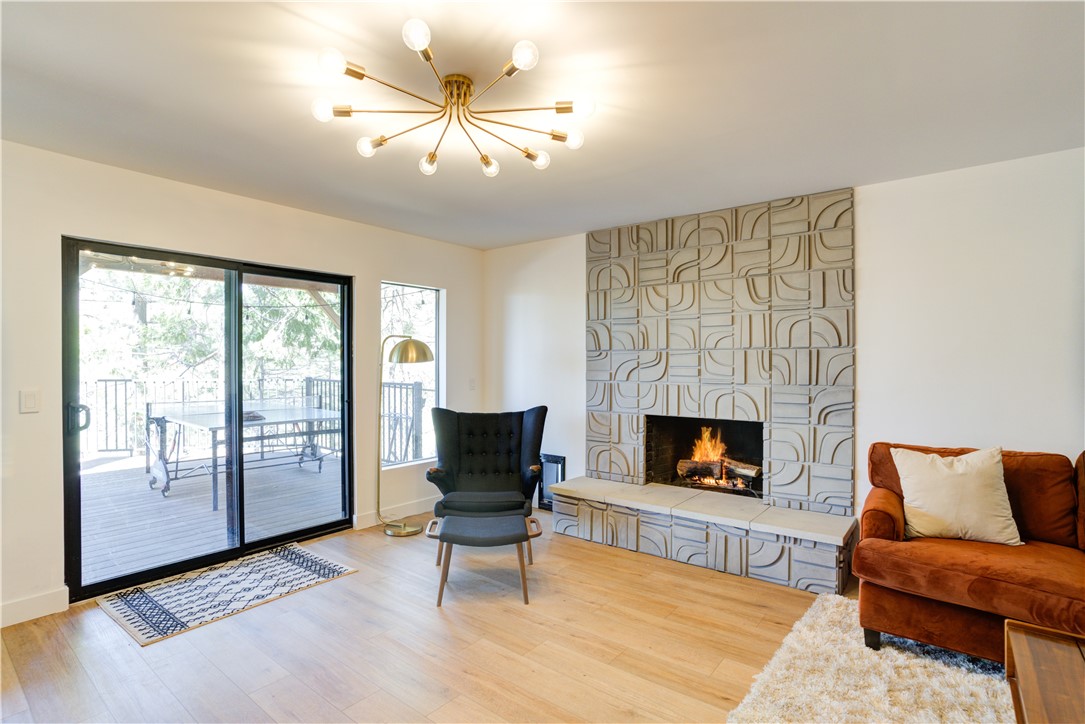 1032 Grass Valley Road Lake Arrowhead, CA 92352 - Photo 29 of 48 a living room with furniture and a fireplace