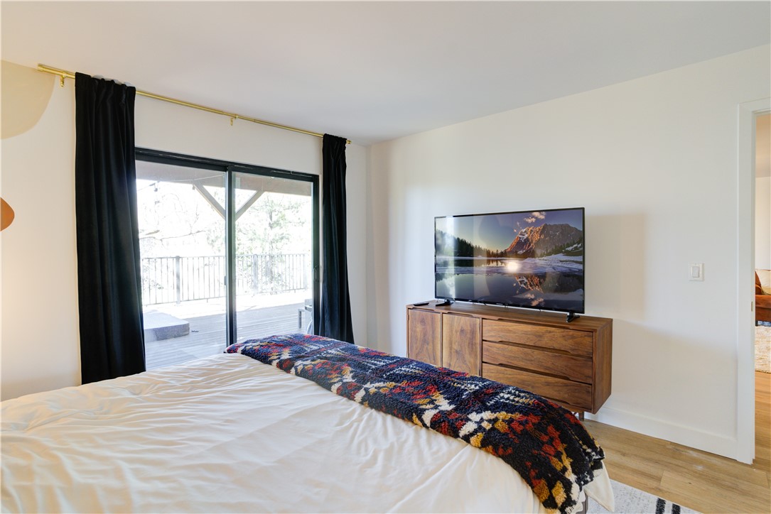 1032 Grass Valley Road Lake Arrowhead, CA 92352 - Photo 32 of 48 a bedroom with a bed and walk in closet