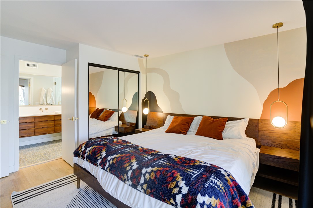 1032 Grass Valley Road Lake Arrowhead, CA 92352 - Photo 33 of 48 a large bed sitting in a bedroom next to a window