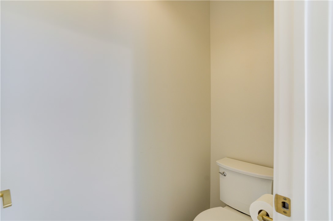 1032 Grass Valley Road Lake Arrowhead, CA 92352 - Photo 36 of 48 a white toilet sitting next to a white wall