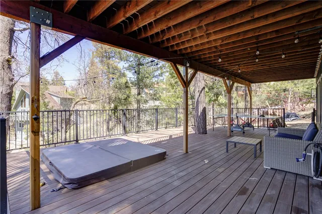 a view of a porch with chairs and backyard