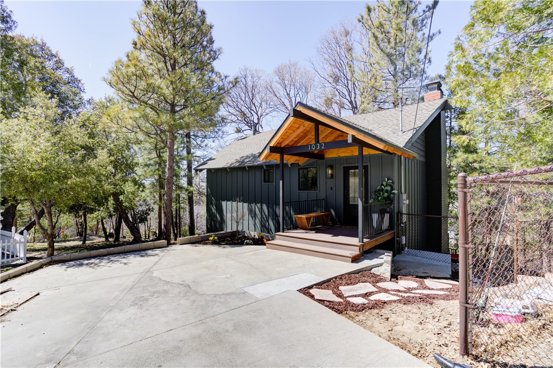1032 Grass Valley Road Lake Arrowhead, CA 92352 - Photo 42 of 48 a wooden bench sitting in front of a house