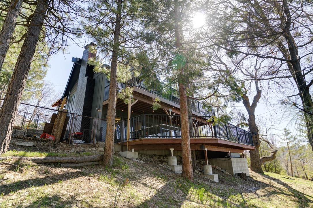 1032 Grass Valley Road Lake Arrowhead, CA 92352 - Photo 45 of 48 a view of a house with a yard fire pit and large tree