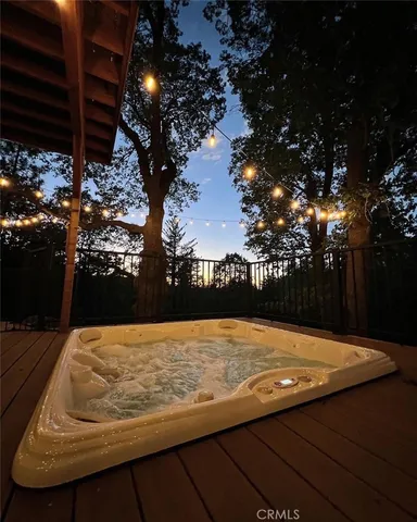 a view of a wooden bench sitting in a backyard