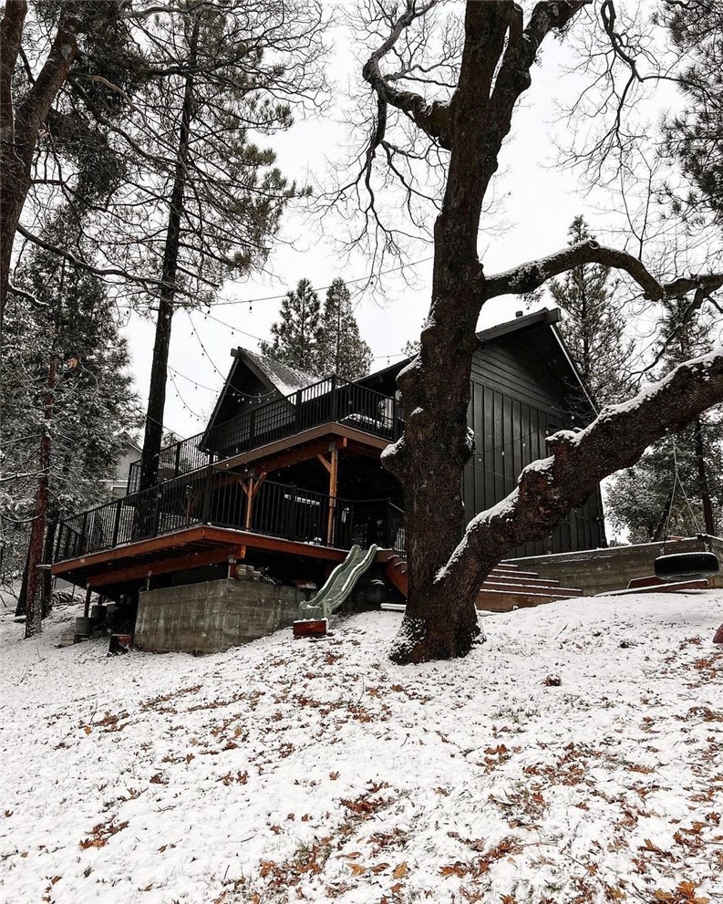 1032 Grass Valley Road Lake Arrowhead, CA 92352 - Photo 48 of 48 a view of a wooden bench sitting in a backyard