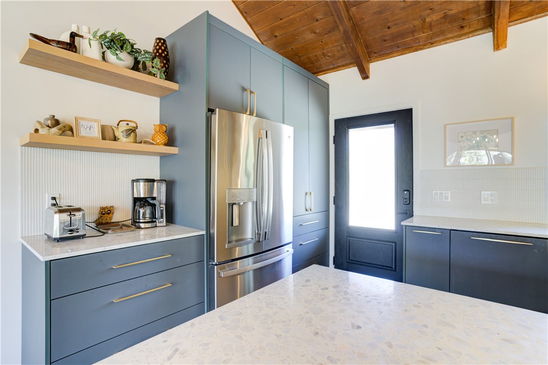 1032 Grass Valley Road Lake Arrowhead, CA 92352 - Photo 5 of 48 a kitchen with stainless steel appliances granite countertop a refrigerator and a sink