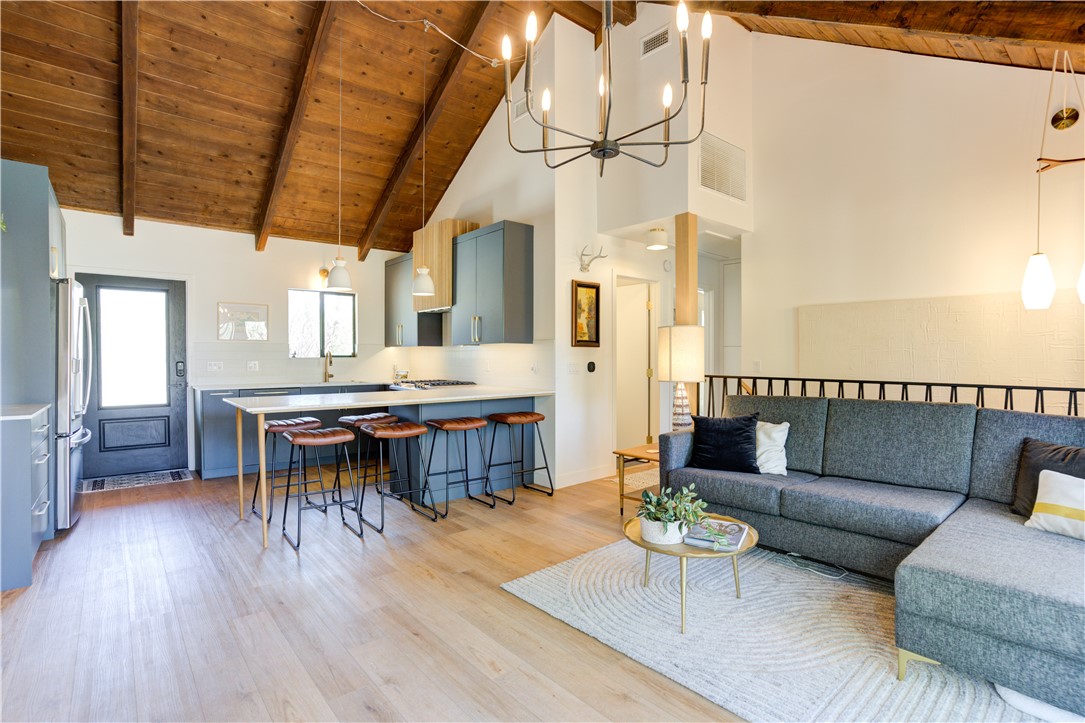 1032 Grass Valley Road Lake Arrowhead, CA 92352 - Photo 9 of 48 a living room with furniture and a wooden floor