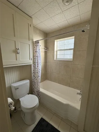 a bathroom with a toilet a sink and bathtub