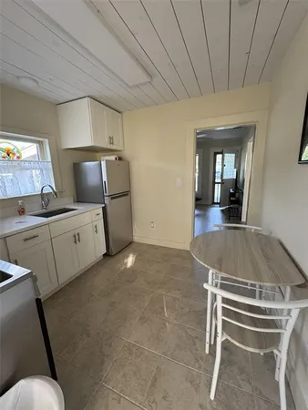 a kitchen with a sink cabinets and appliances