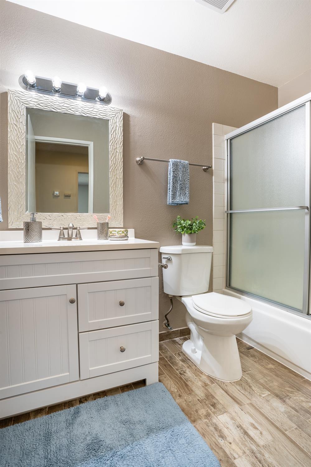 29 Dean Way Folsom, CA 95630 - Photo 16 of 17 a bathroom with a toilet a sink and mirror