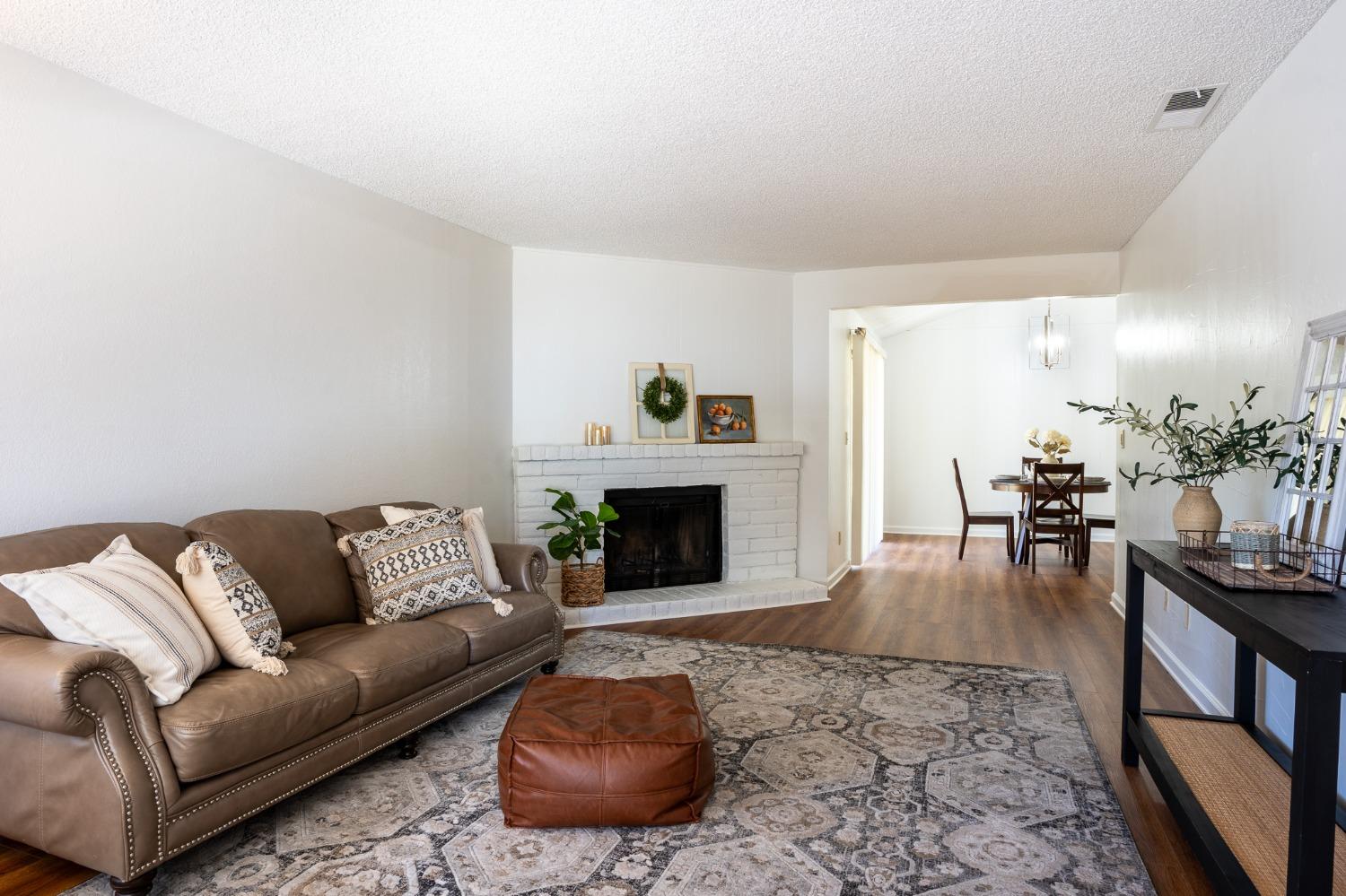 29 Dean Way Folsom, CA 95630 - Photo 2 of 17 a living room with furniture and a fireplace