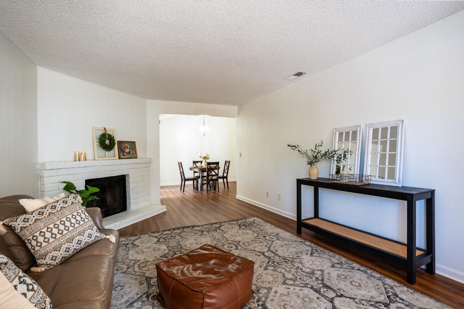 29 Dean Way Folsom, CA 95630 - Photo 4 of 17 a living room with furniture and a fireplace