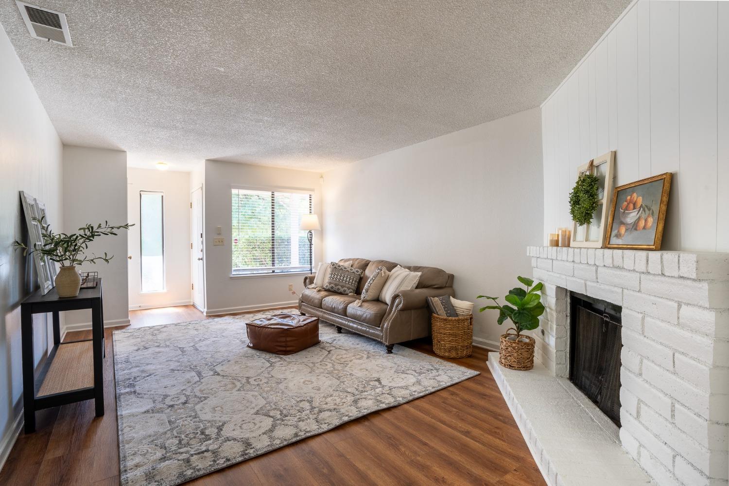29 Dean Way Folsom, CA 95630 - Photo 5 of 17 a living room with furniture and a fireplace