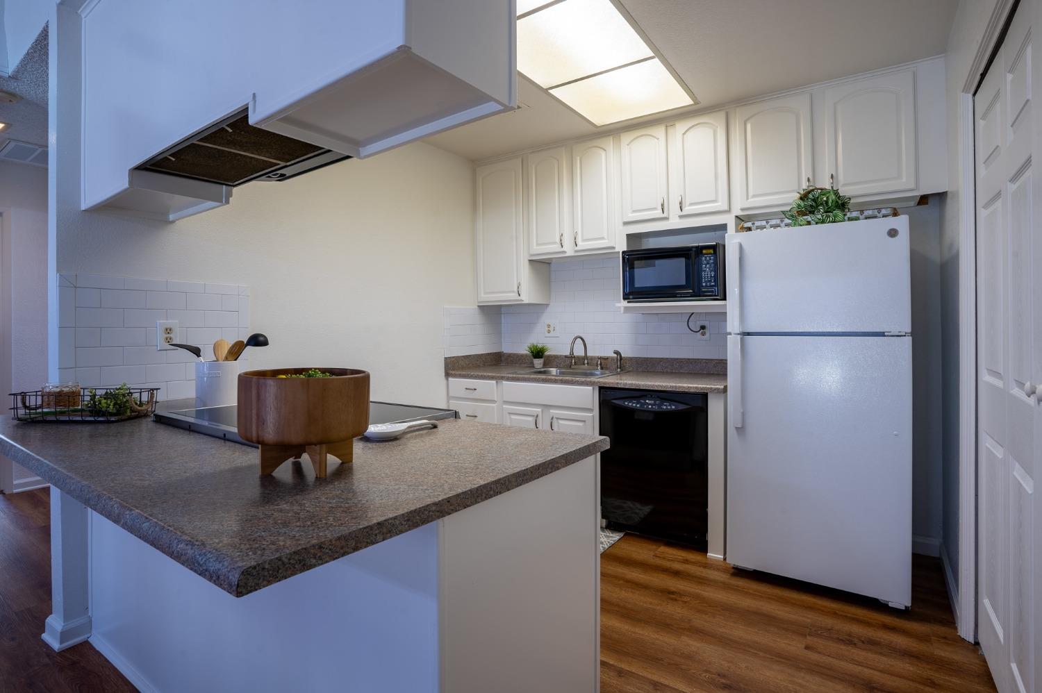 29 Dean Way Folsom, CA 95630 - Photo 8 of 17 a kitchen with a refrigerator a stove a sink and a microwave