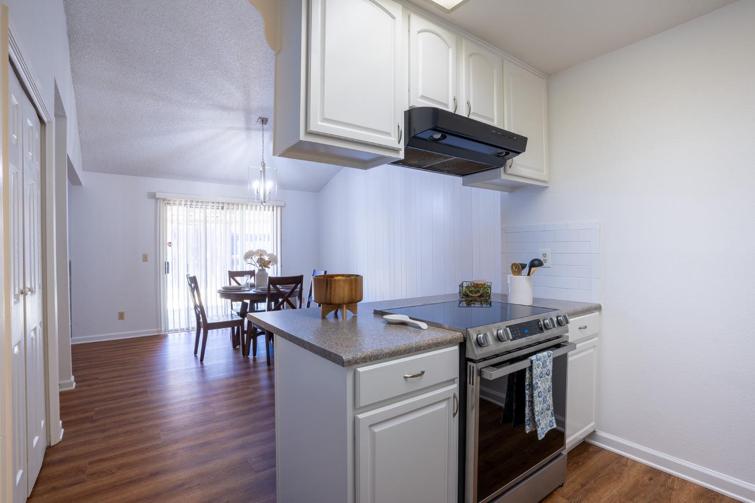 29 Dean Way Folsom, CA 95630 - Photo 10 of 17 a kitchen with stainless steel appliances granite countertop a stove and a wooden cabinets