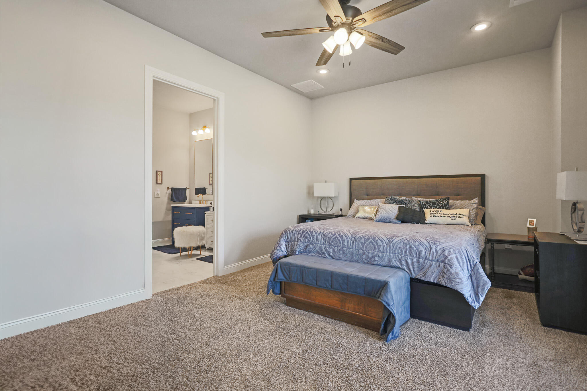 301 Fagan Road Snyder, TX 79549 - Photo 44 of 102 a bedroom with a bed and a chandelier