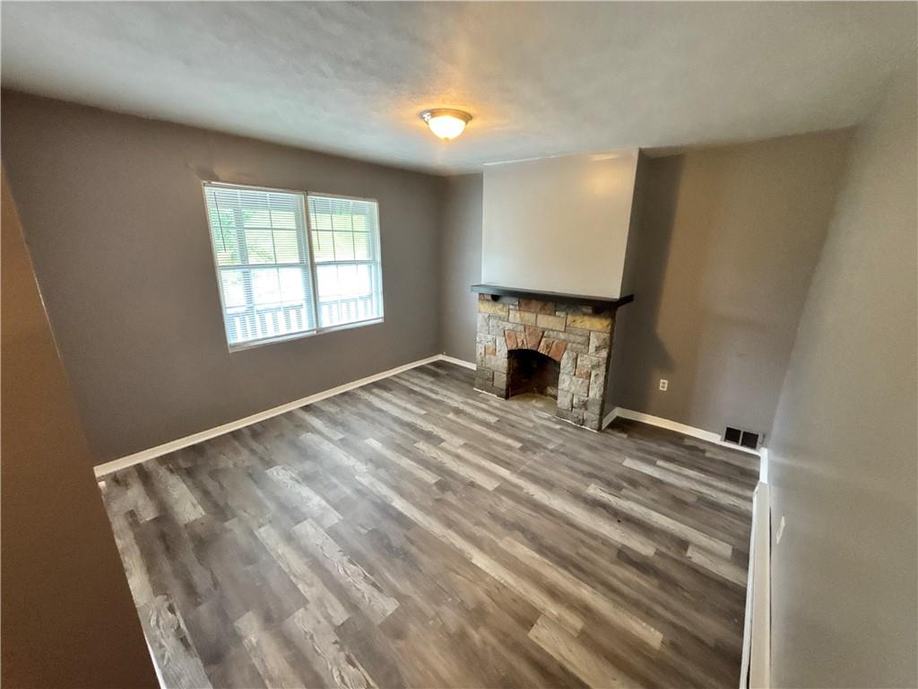 335 Cedarhurst Street Pittsburgh, PA 15210 - Photo 2 of 28 a view of empty room with wooden floor and fan