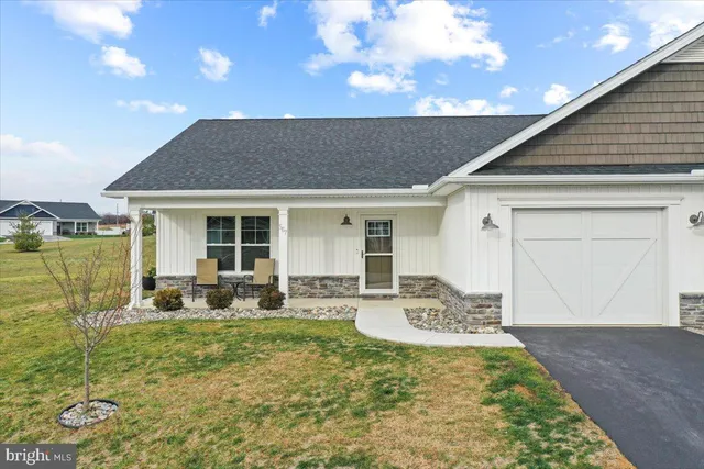 a front view of house with outdoor seating