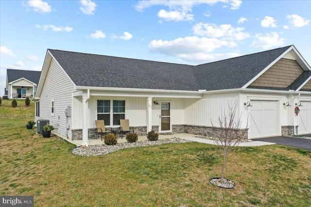 a front view of house with yard outdoor seating