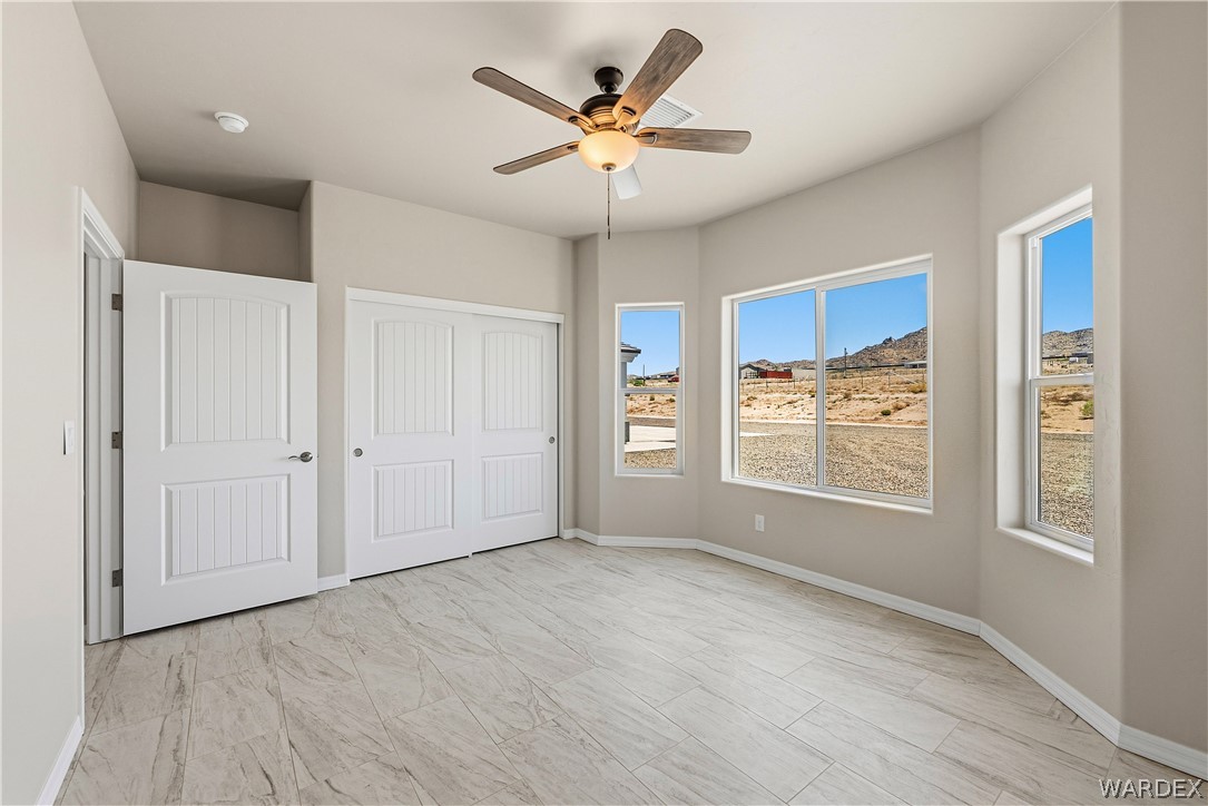 9818 North Cyrus Road Kingman, AZ 86401 - Photo 19 of 42 a view of an empty room with a window