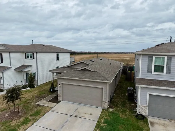 a view of a house with a sink and a yard