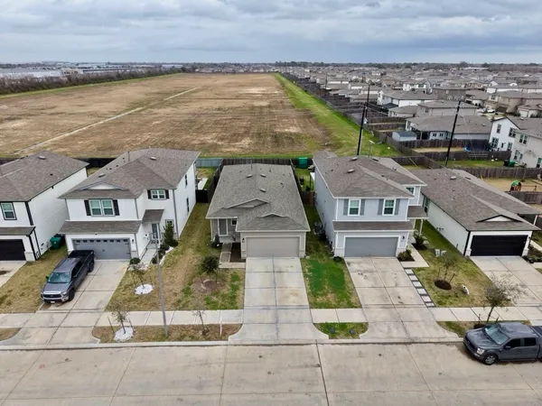 an aerial view of a house with lake view