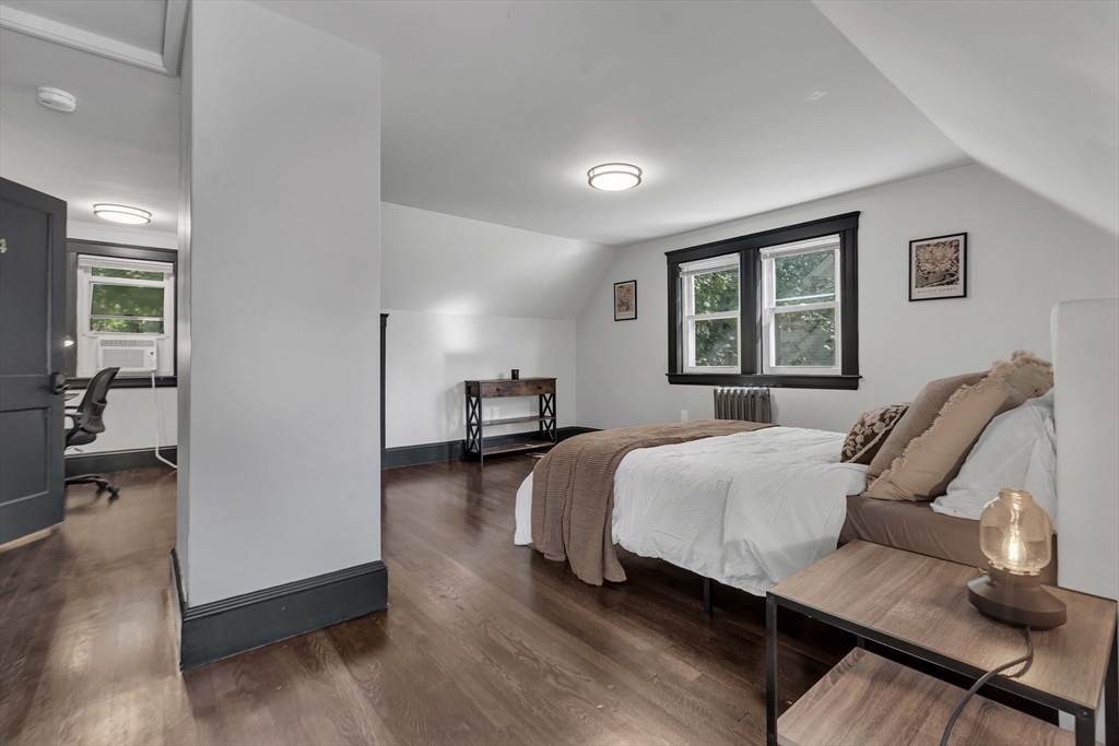 50 Sprague Street Dedham, MA 02026 - Photo 13 of 28 a bedroom with furniture and a window