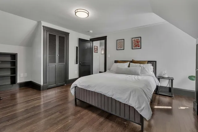 a bedroom with a bed and closet