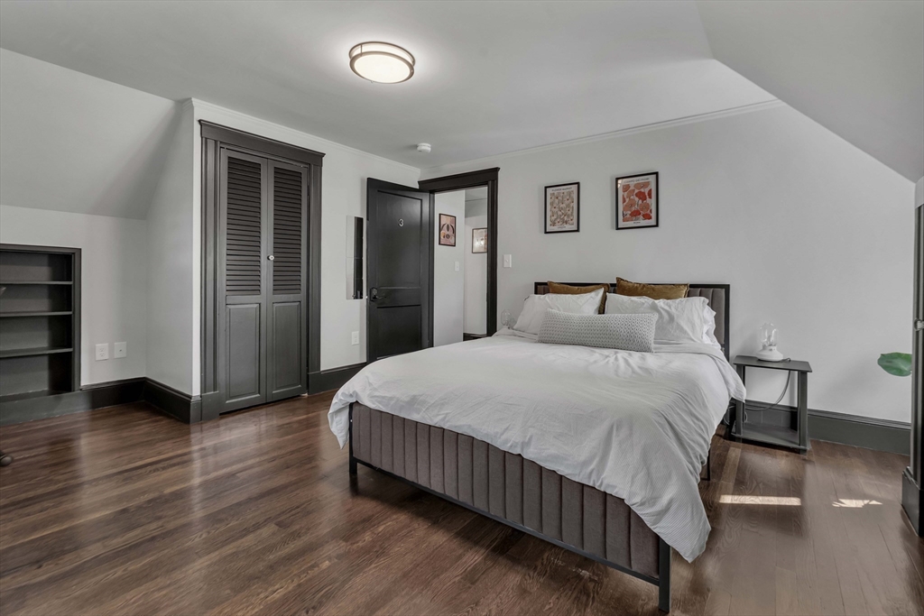 50 Sprague Street Dedham, MA 02026 - Photo 15 of 28 a bedroom with a bed and closet