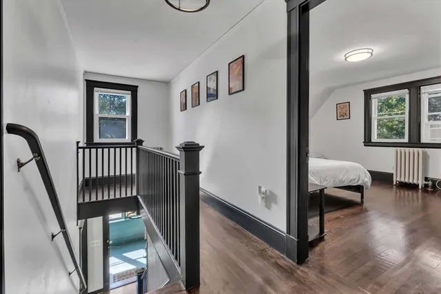 a bedroom with furniture and a window