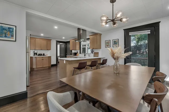 a view of kitchen and dining area with furniture