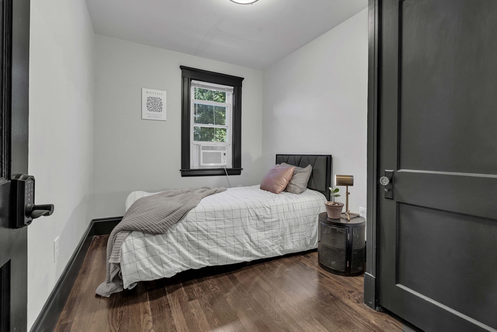 50 Sprague Street Dedham, MA 02026 - Photo 21 of 28 a bedroom with a bed and a window