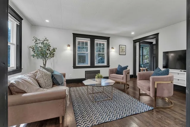 a living room with furniture or couch and a flat screen tv