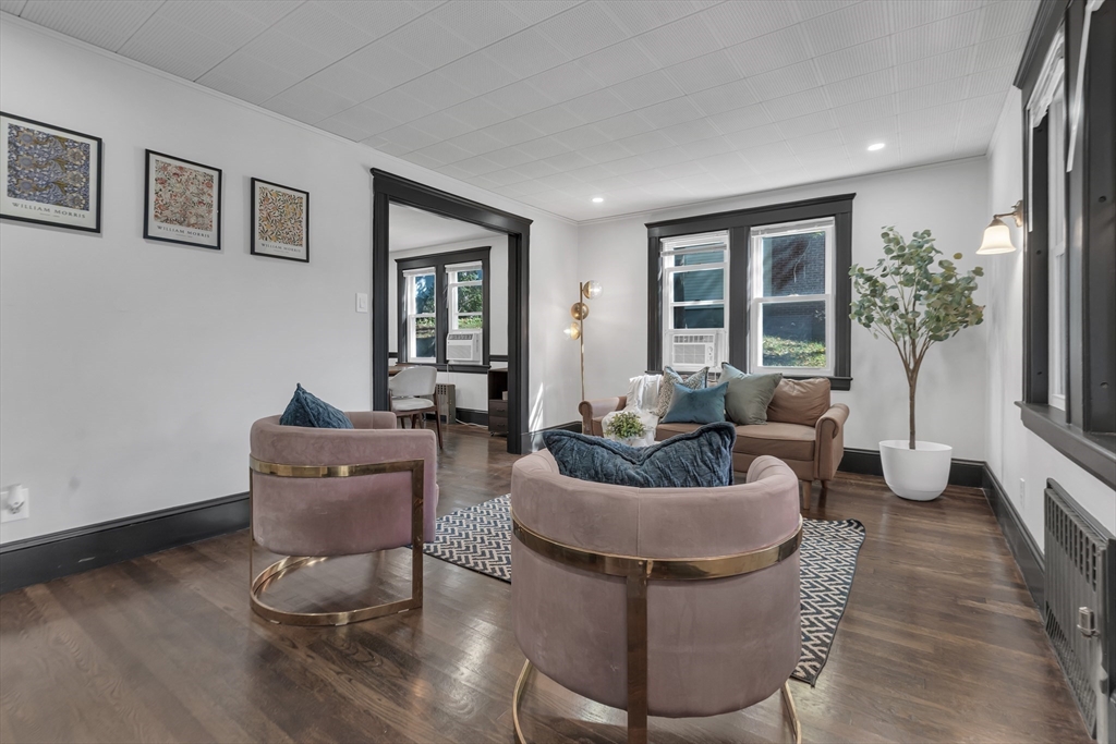 50 Sprague Street Dedham, MA 02026 - Photo 5 of 28 a living room with furniture and a potted plant