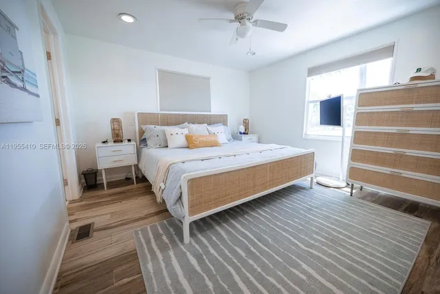 a bedroom with a bed and a walk in closet