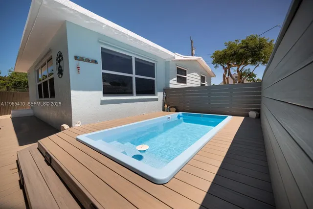 a view of a two chairs in the balcony