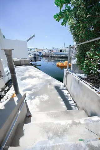 a view of swimming pool with outdoor seating and plants