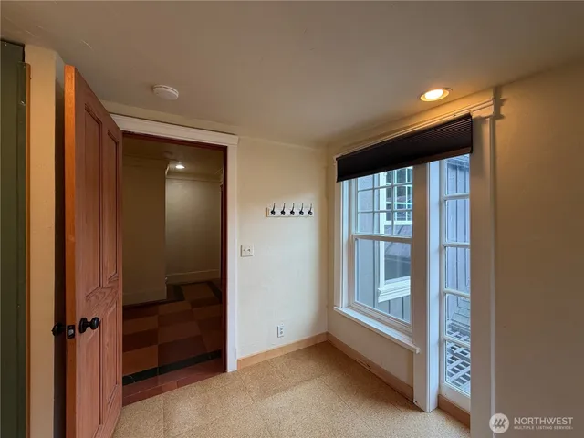 a view of a entryway door with wooden floor