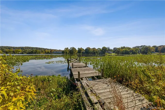 a view of a lake with a big yard