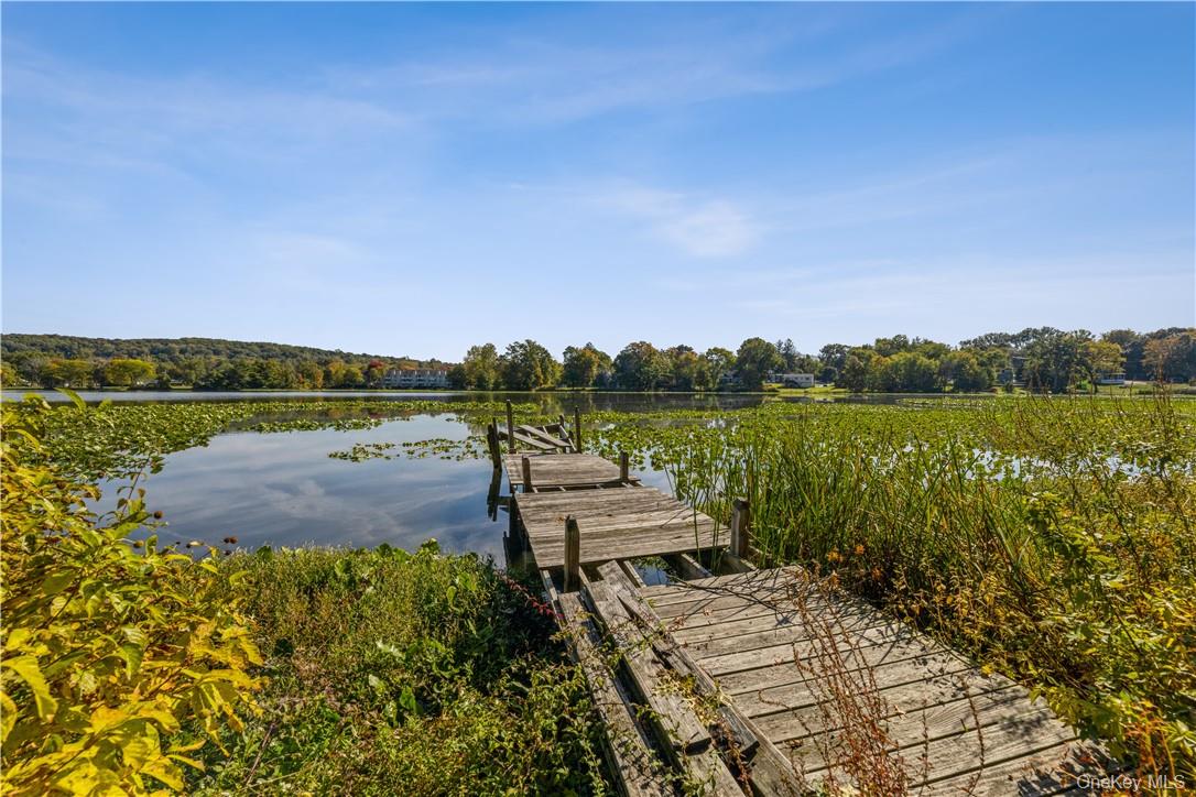 48 Lakewood Drive Congers, NY 10920 - Photo 18 of 19 a view of a lake with a big yard